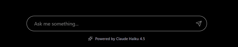The chat input on the homepage: a rounded text field reading "Ask me something..." with a send arrow, and the caption "Powered by Claude Haiku 4.5" underneath.