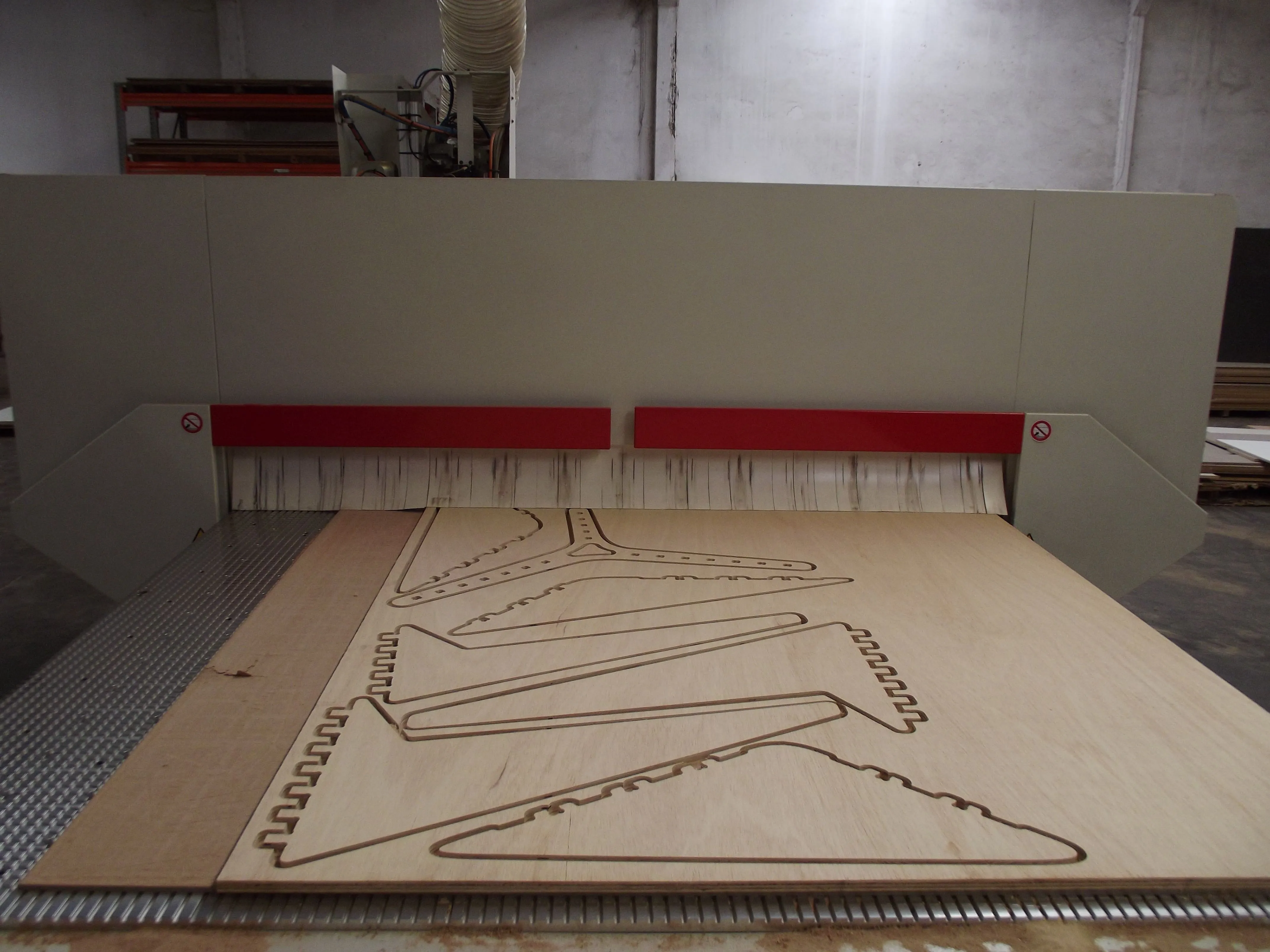 CNC machine cutting the table pieces.