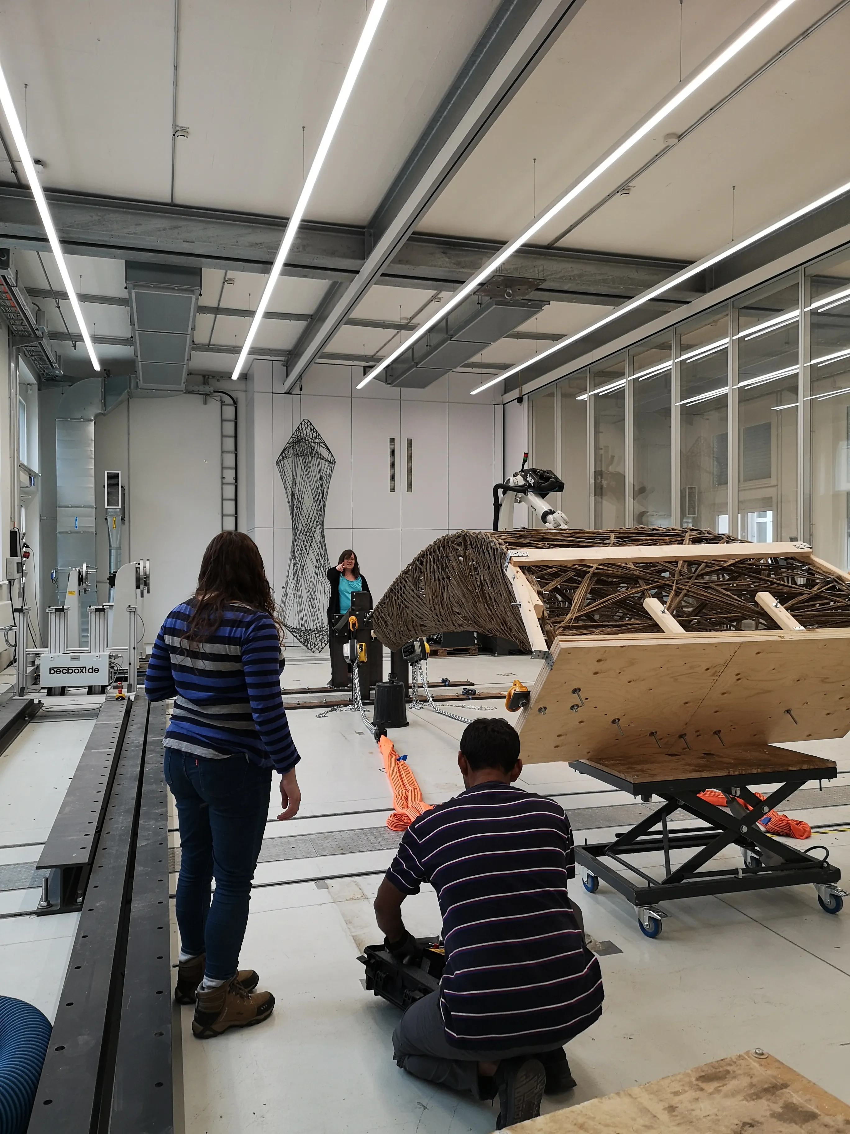 Natural fiber wound specimen secured with load straps for structural testing at ITKE Stuttgart.