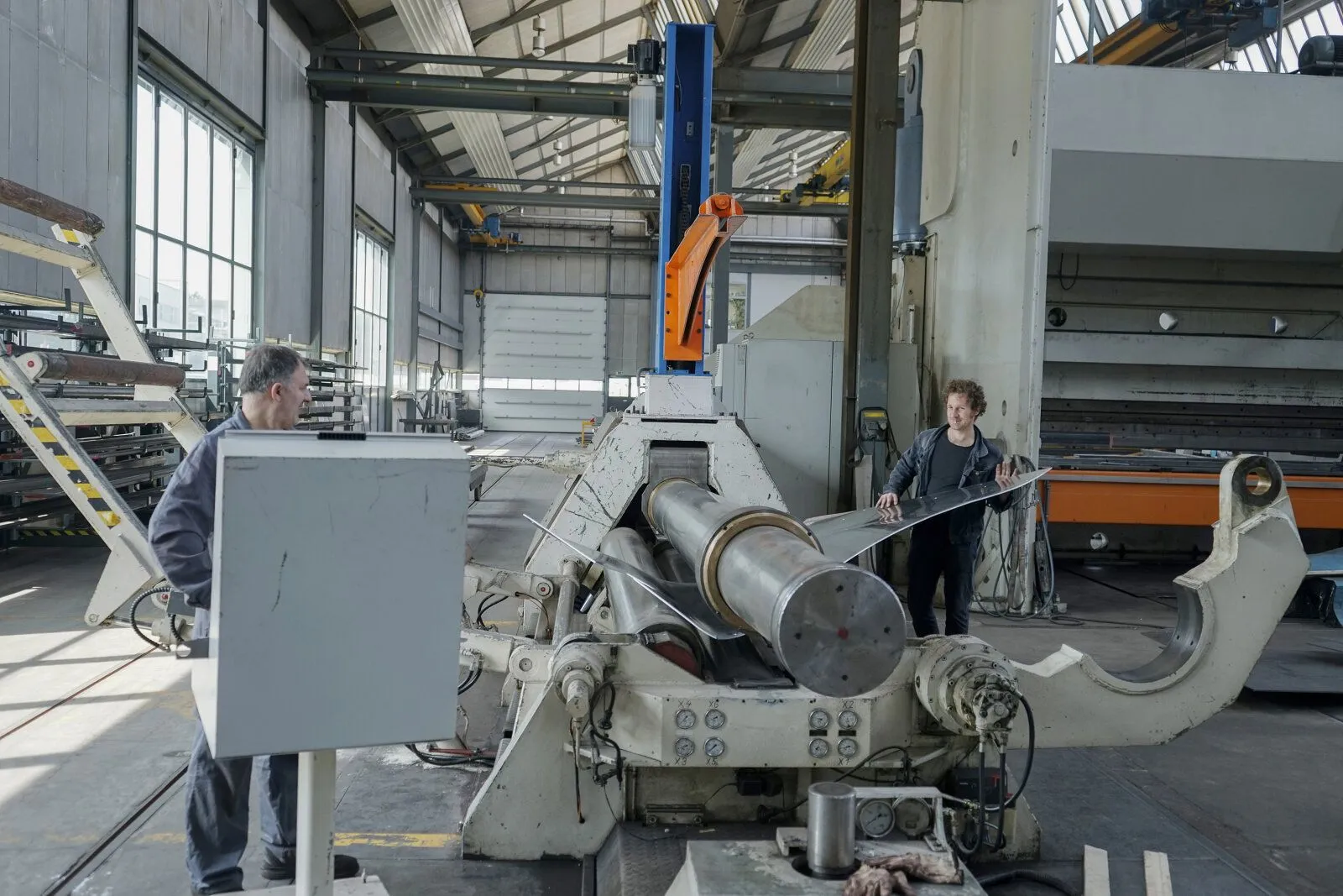 Photo of a steel-plate-bending machine with a custom angle.