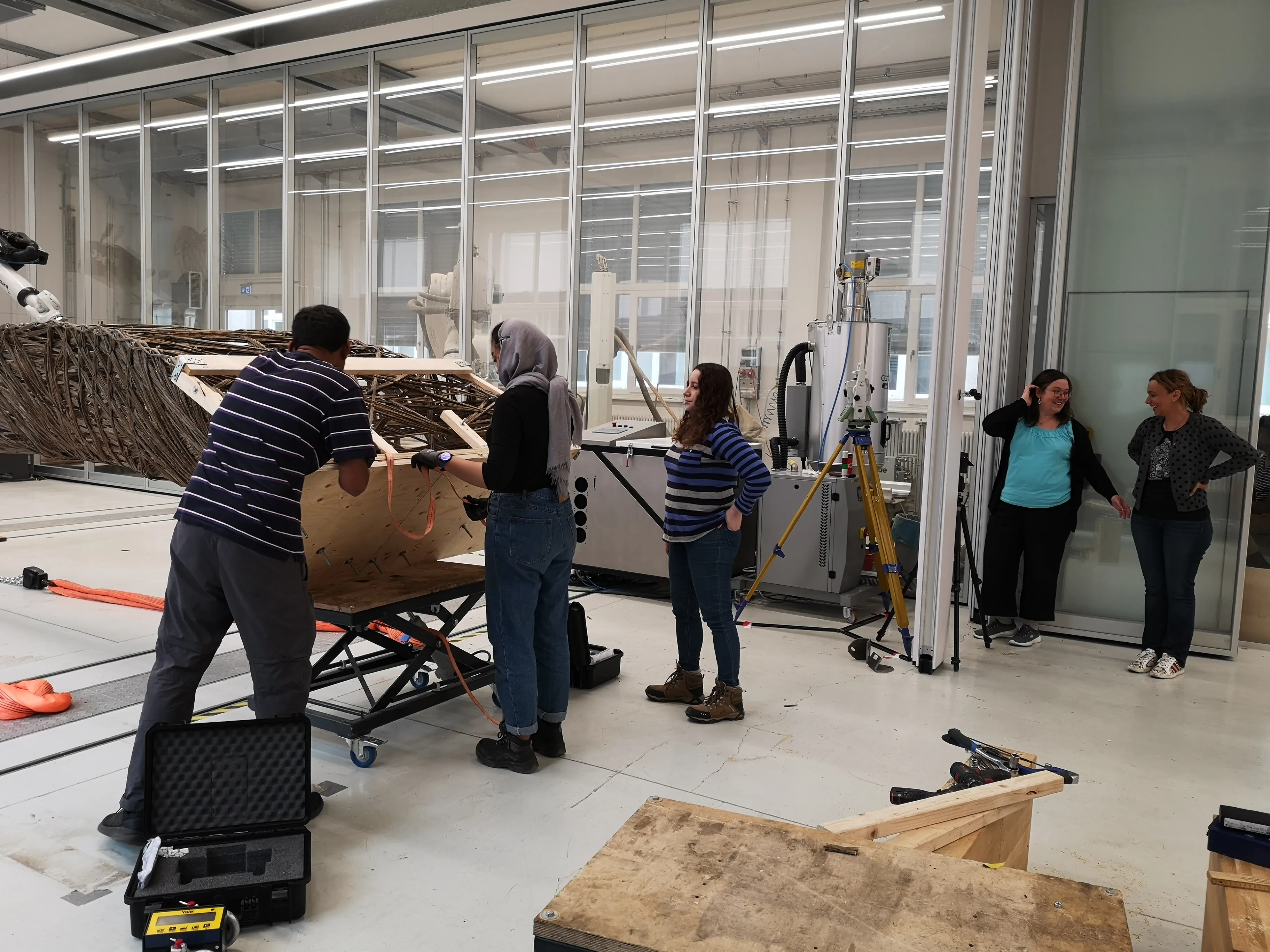 The full load testing setup with the natural fiber specimen secured on a hydraulic platform.