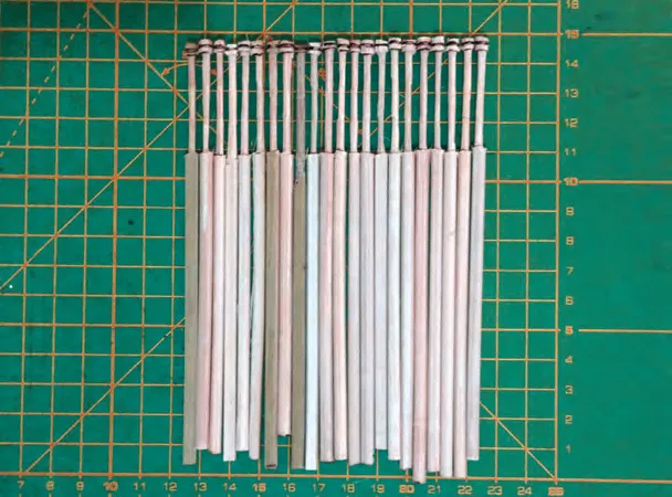 Materials for the model: wooden bobbins