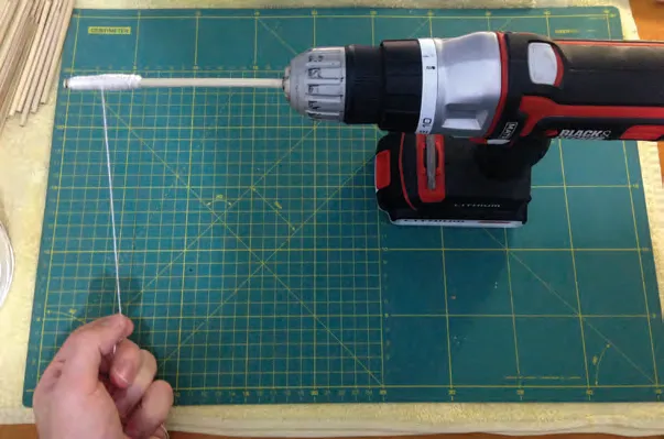 Preparing the bobbins with a drill