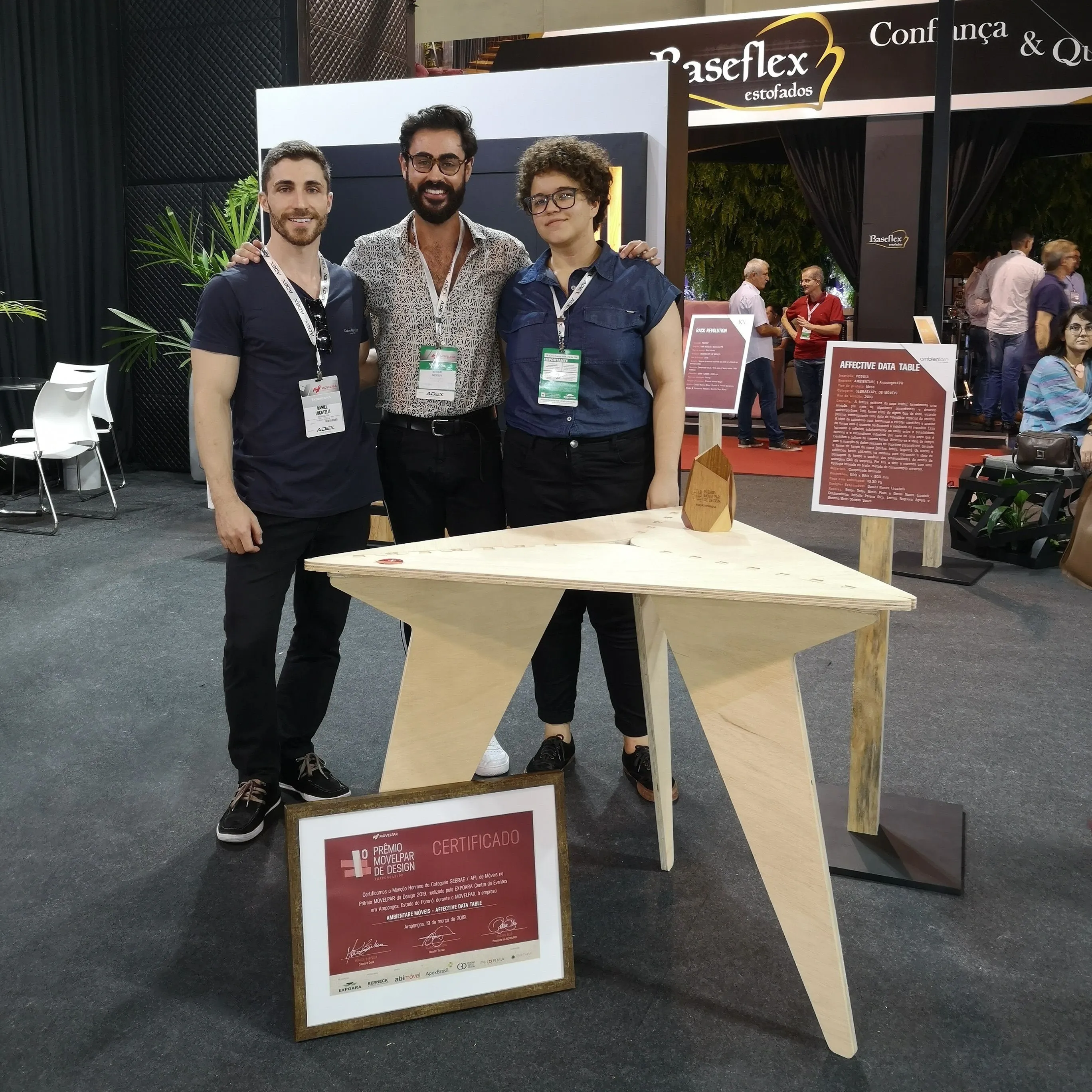 Team photo: Daniel, Renan, and Larissa.