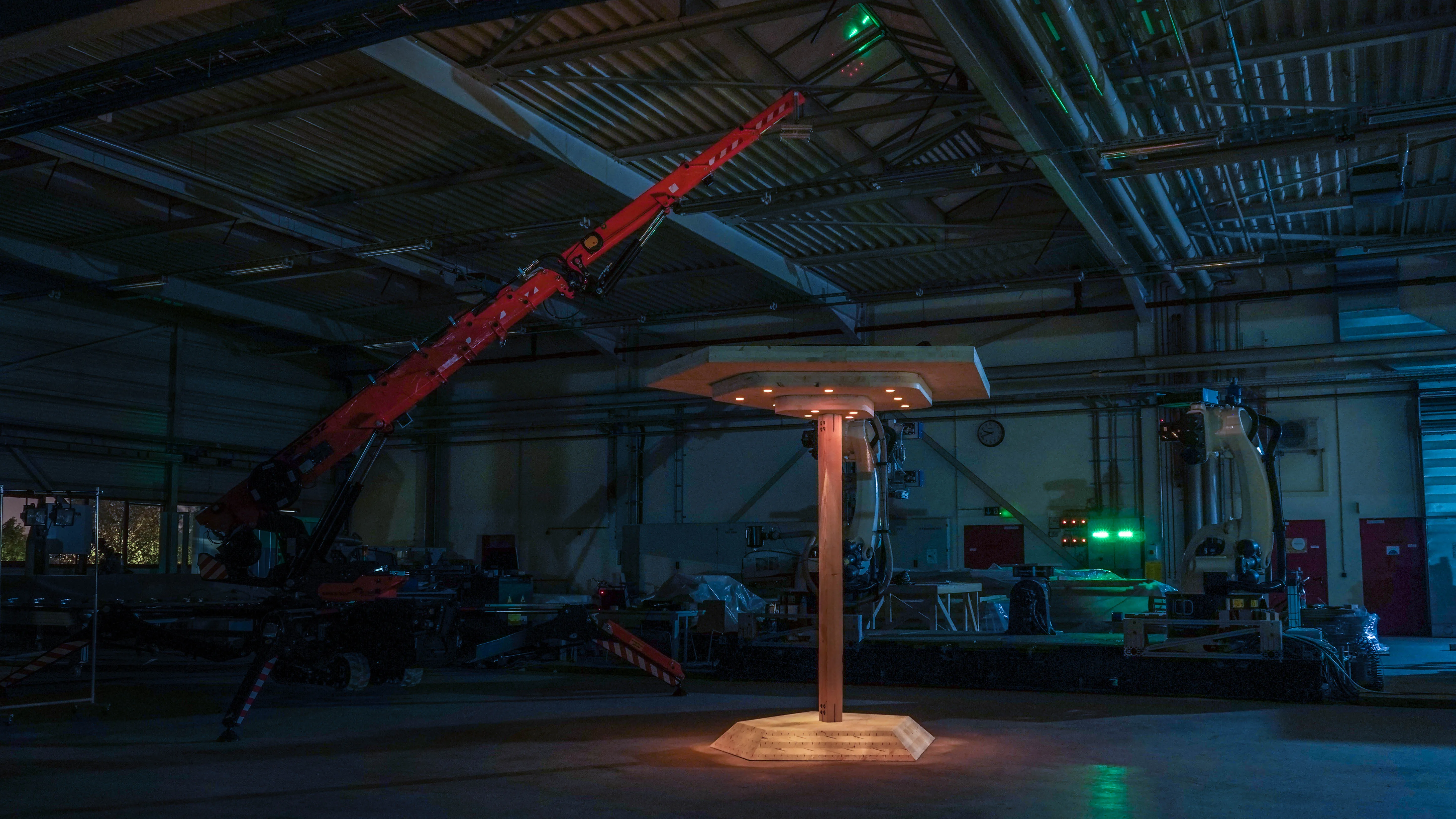 Photo of the demonstrator at night: the holes for the clamping robots are now used for light fixtures.