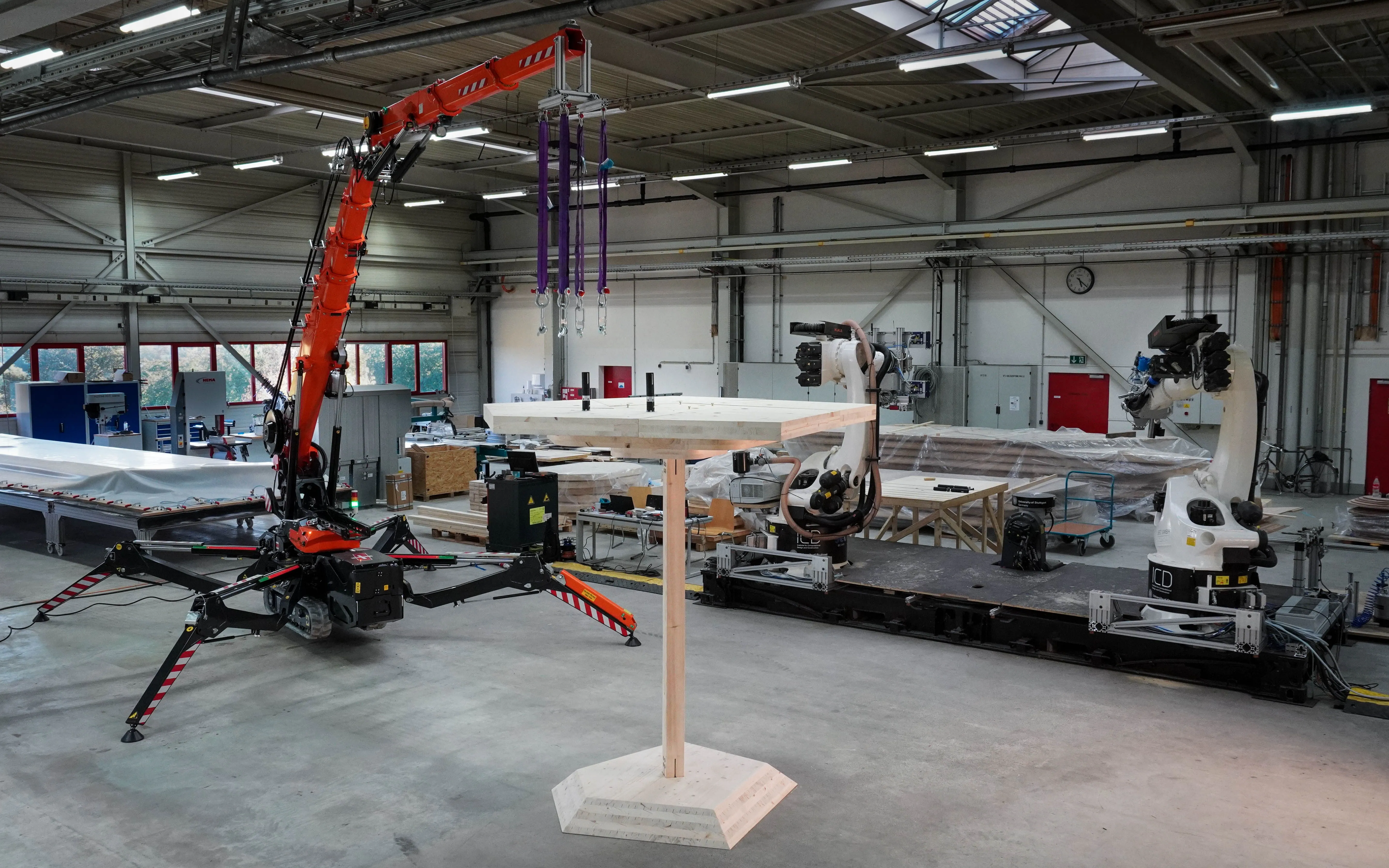 Figure 65 - Demonstrated construction site setup: mobile robotic platform (TIM), spider crane and the custom device.